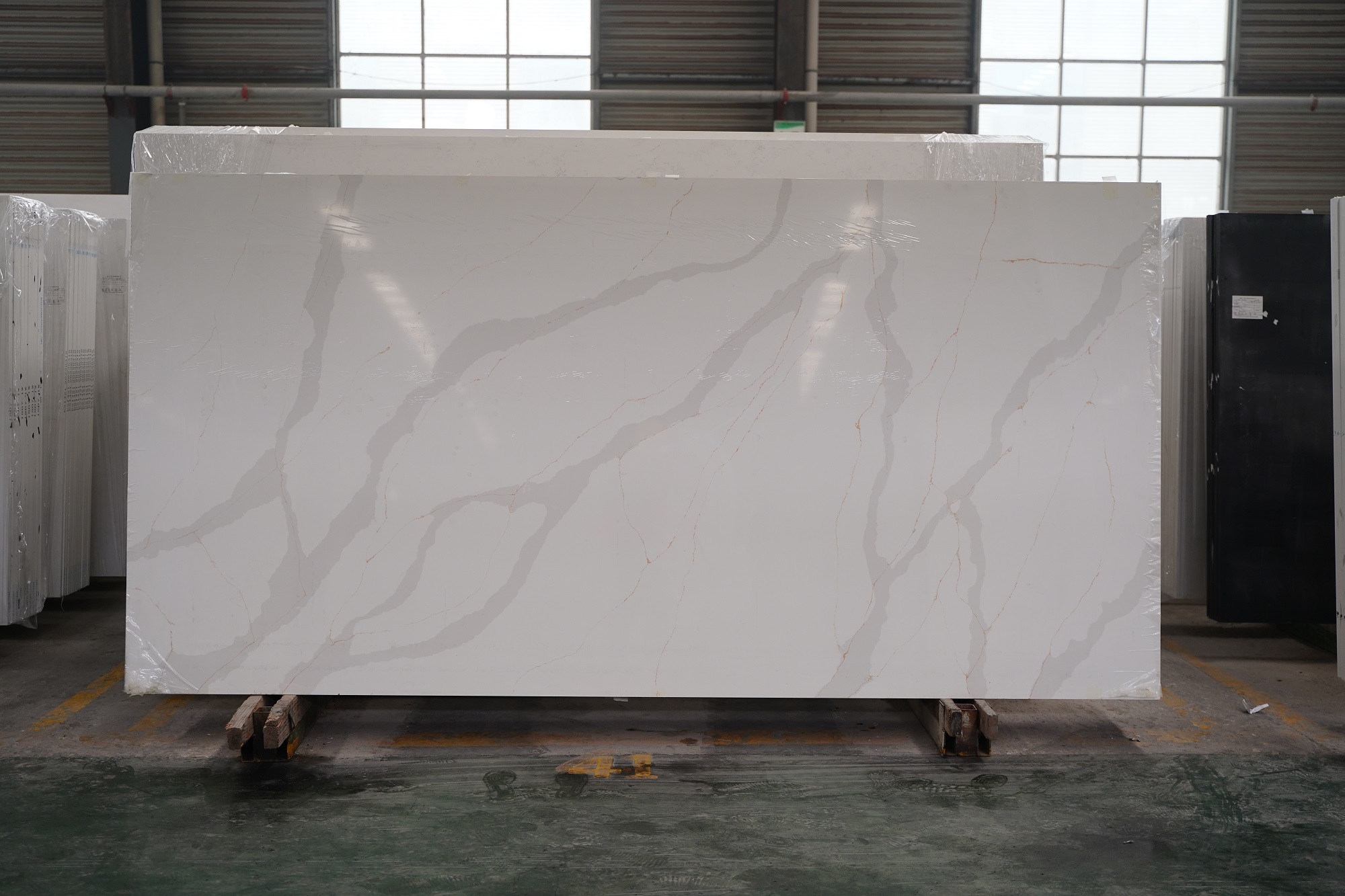 Calacatta quartz slab with gold veins