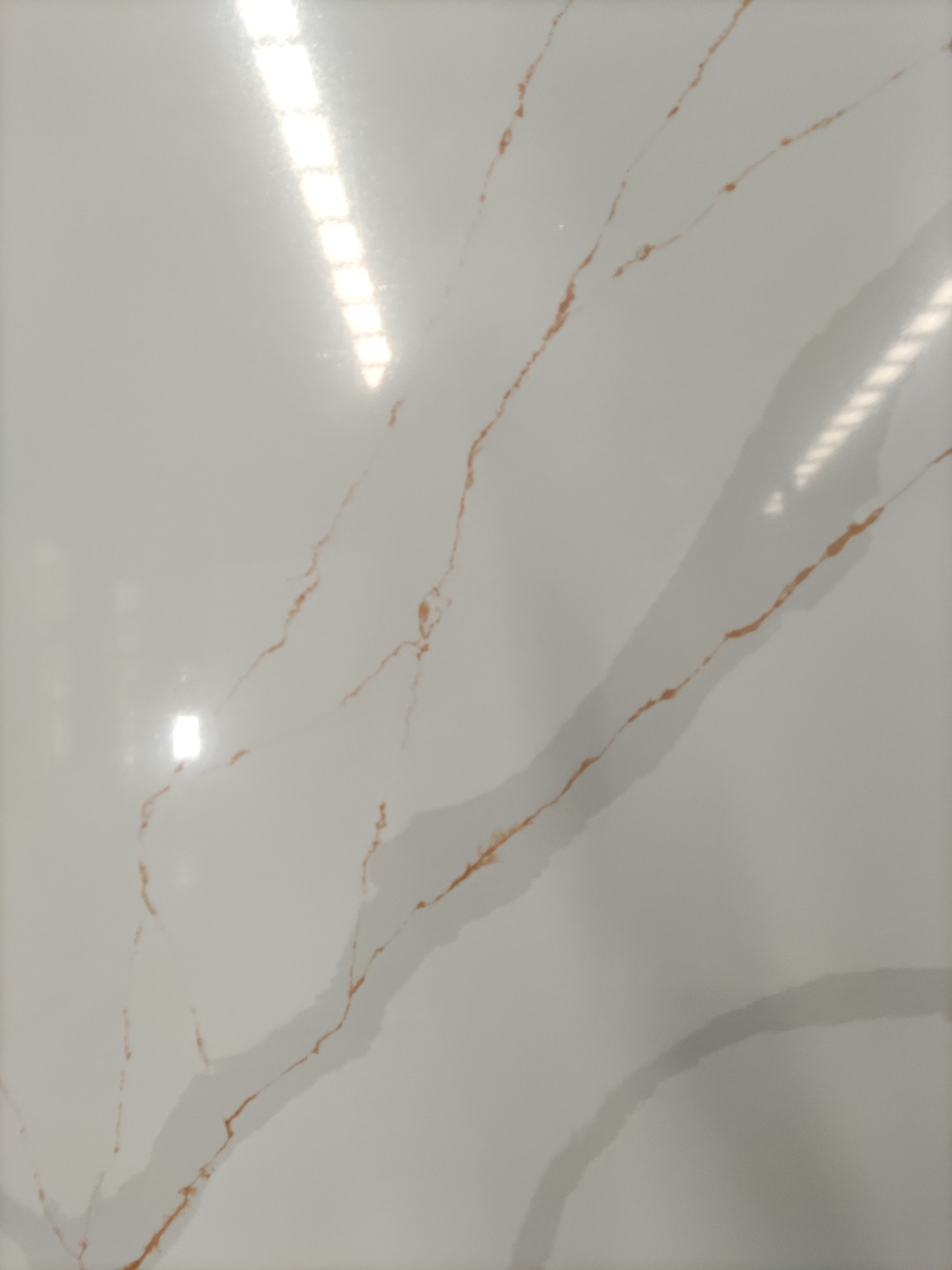 Calacatta quartz slab with gold veins